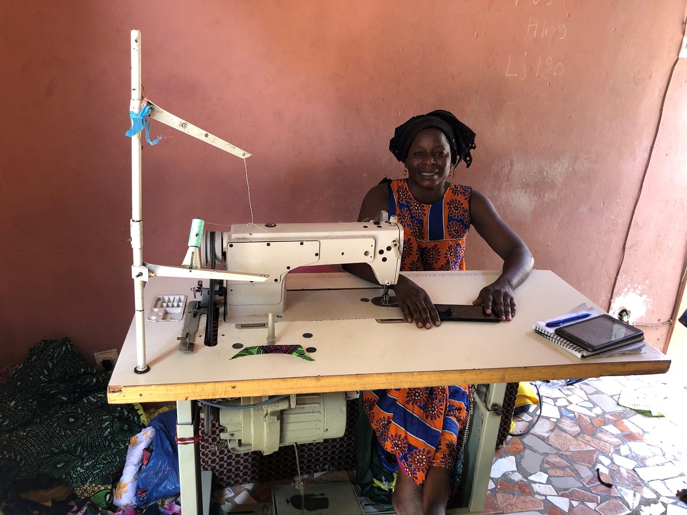 Tata Awa from Cherif Lô with her sewing machine after her community was connected to electricity.