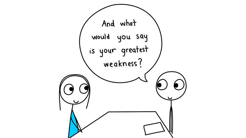 Comic of 2 stick figures, one coded male interviewing another coded female, sitting on opposite sides of a table with a piece of paper in front of the interviewer. The text bubble indicates the interviewer is saying “And what would you say is your greatest weakness?”