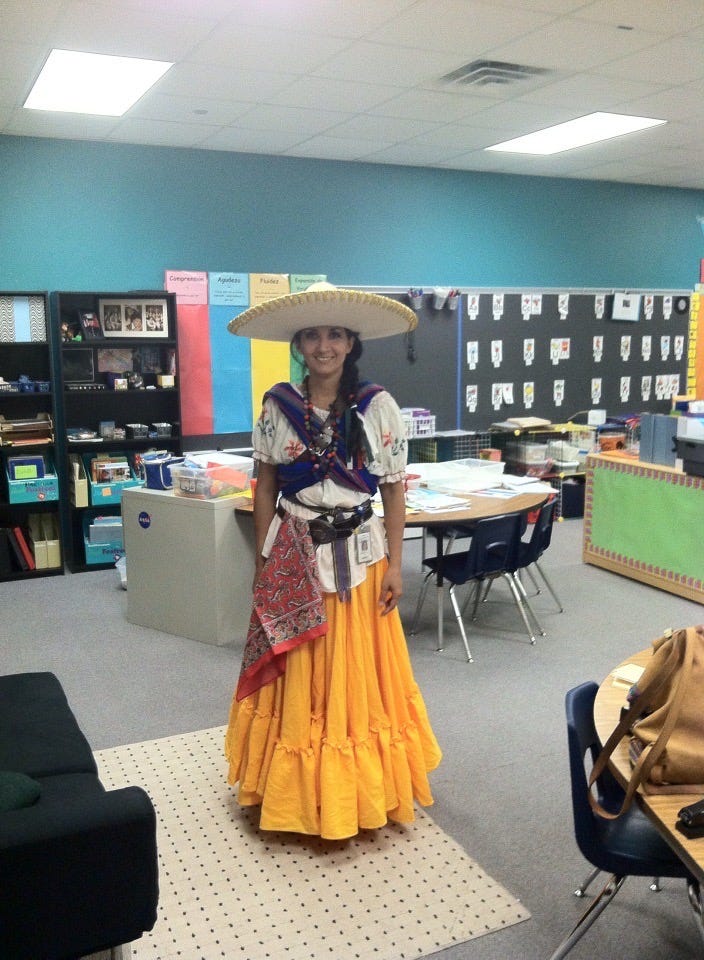 Irma Mancilla, the author’s mother, dressed in a traditional mexican outfit in an elementary school classroom.