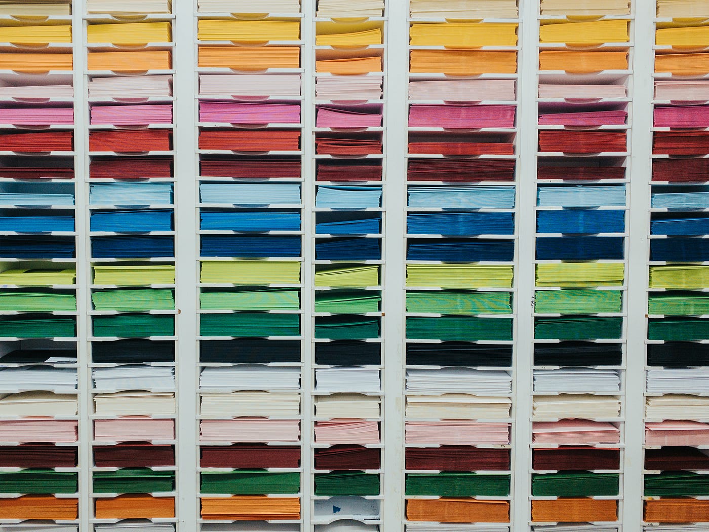 Cabinet holding stacks of colored paper