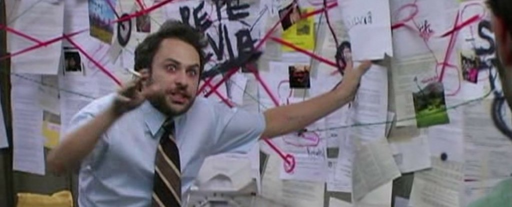 The famous meme of a way with crazy looks and a wall full of paper scraps behind.