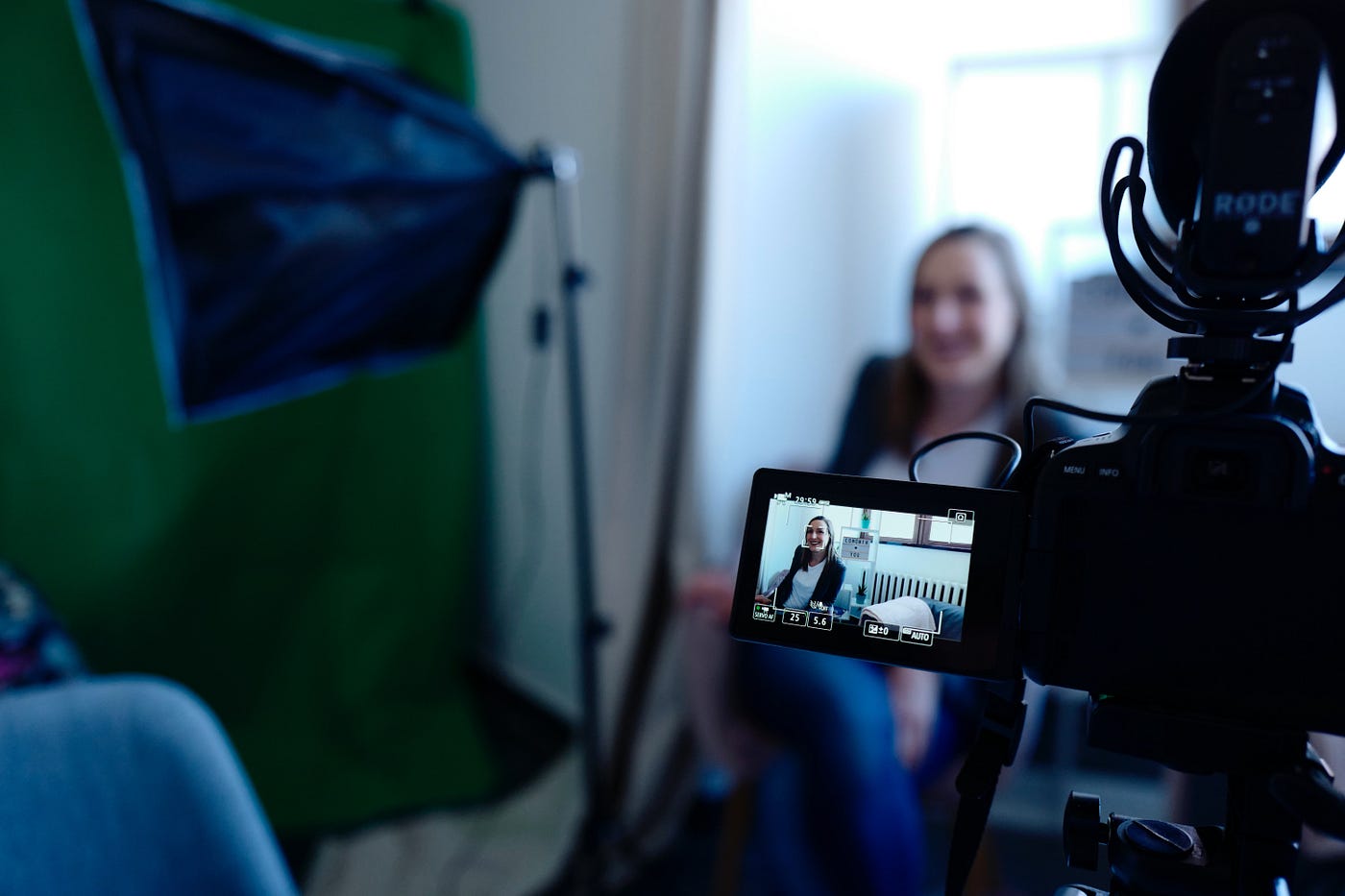 Photo of a woman being filmed