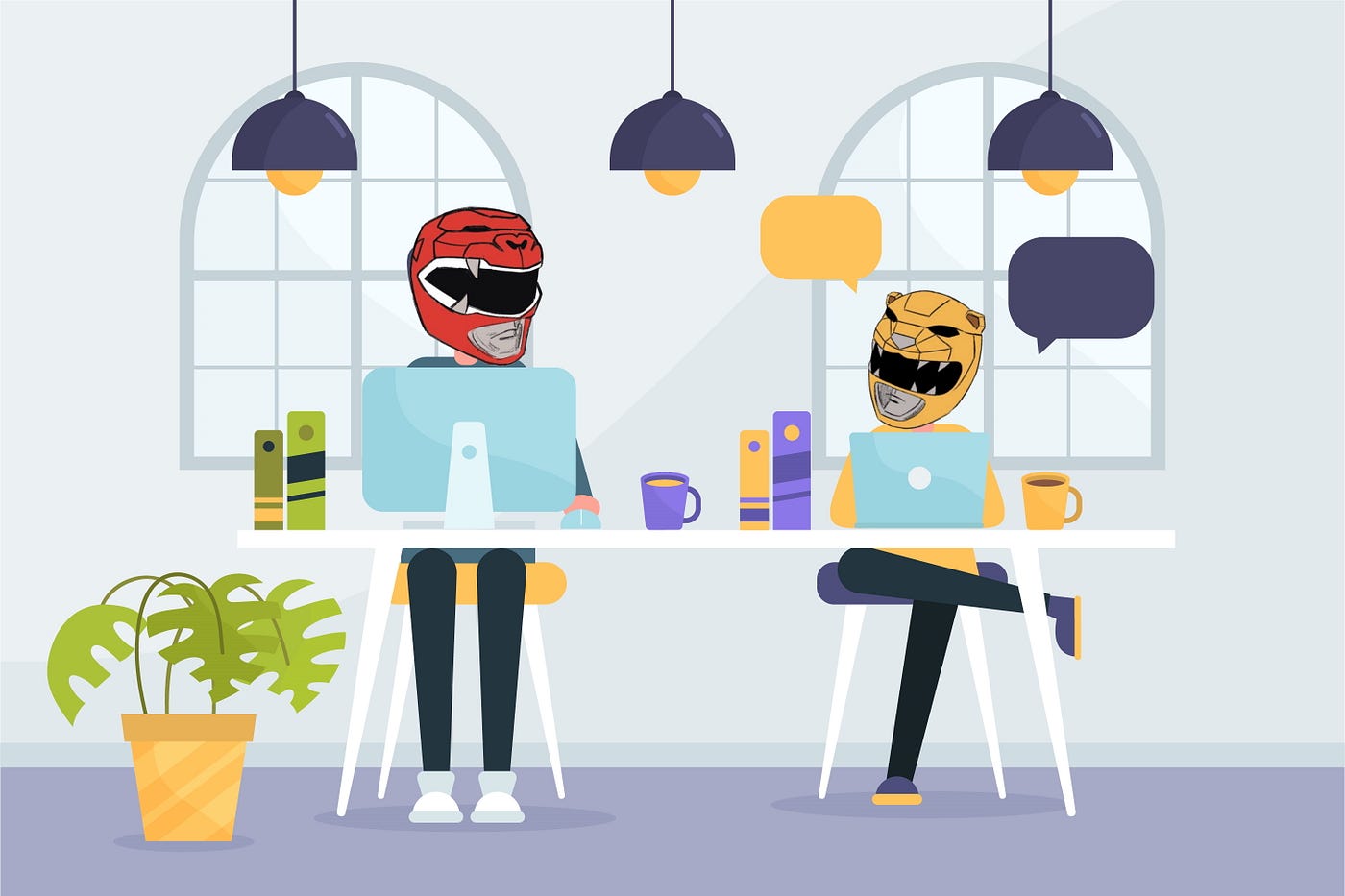 Two people sitting in an office while wearing Power Rangers helmets.