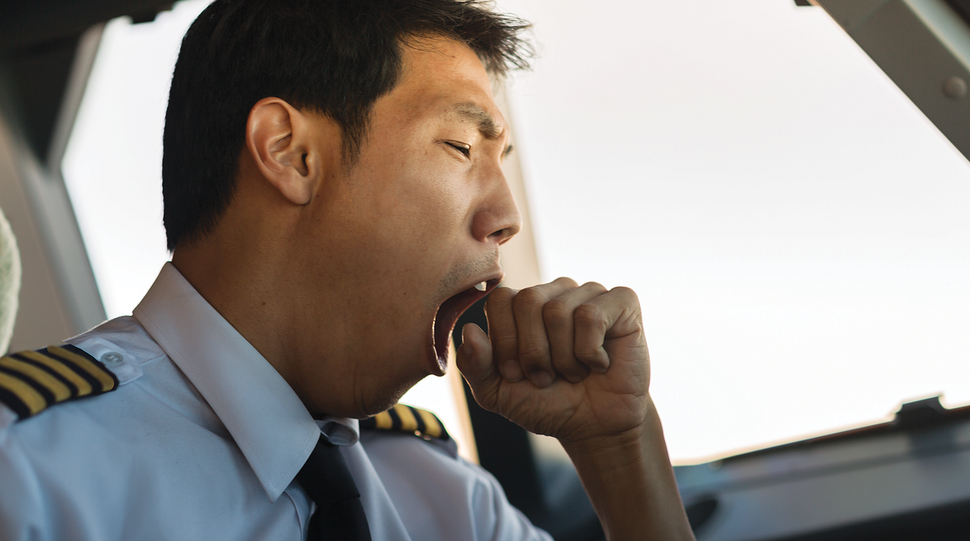 Photo of a pilot yawning.