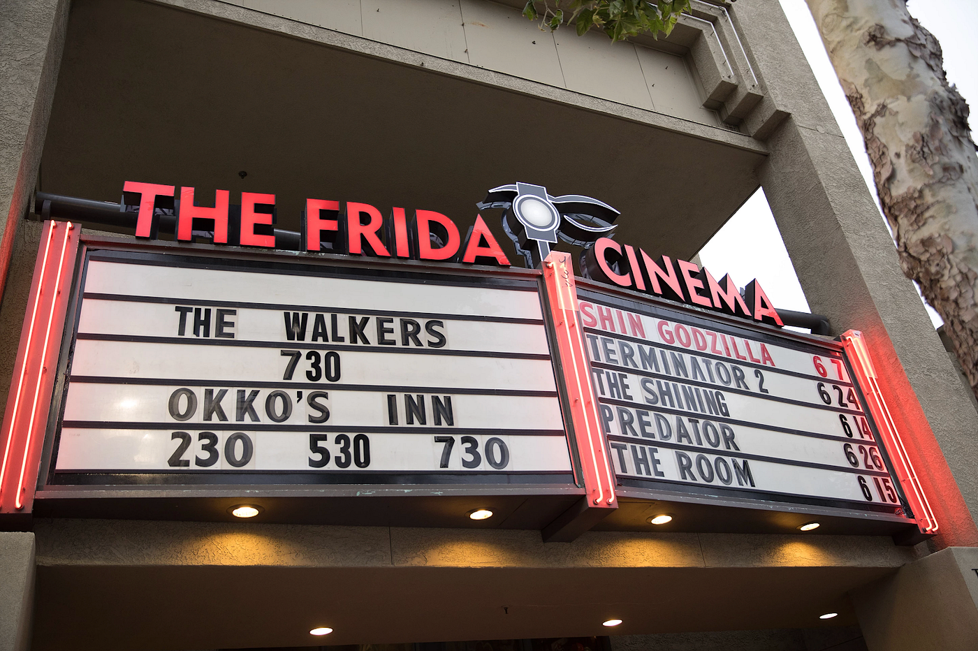 box office title with cinema name in red at the top: THE FRIDA CINEMA. Shows include “THE WALKERS 7:30”