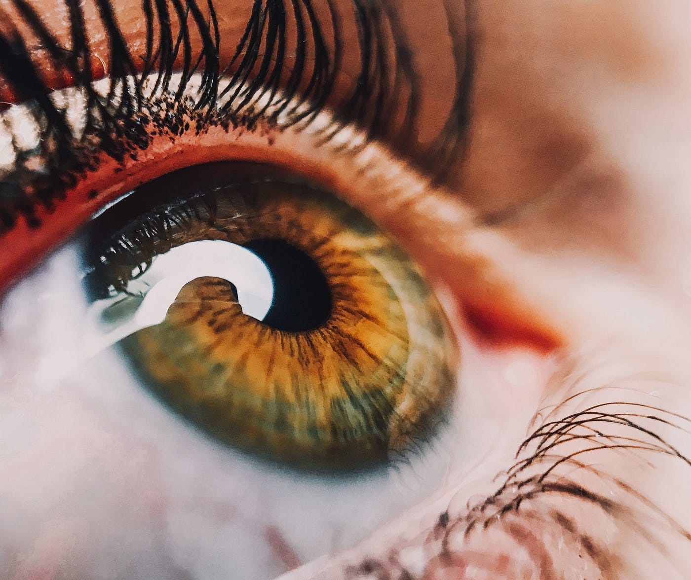 Close up of a human eye looking upwards.