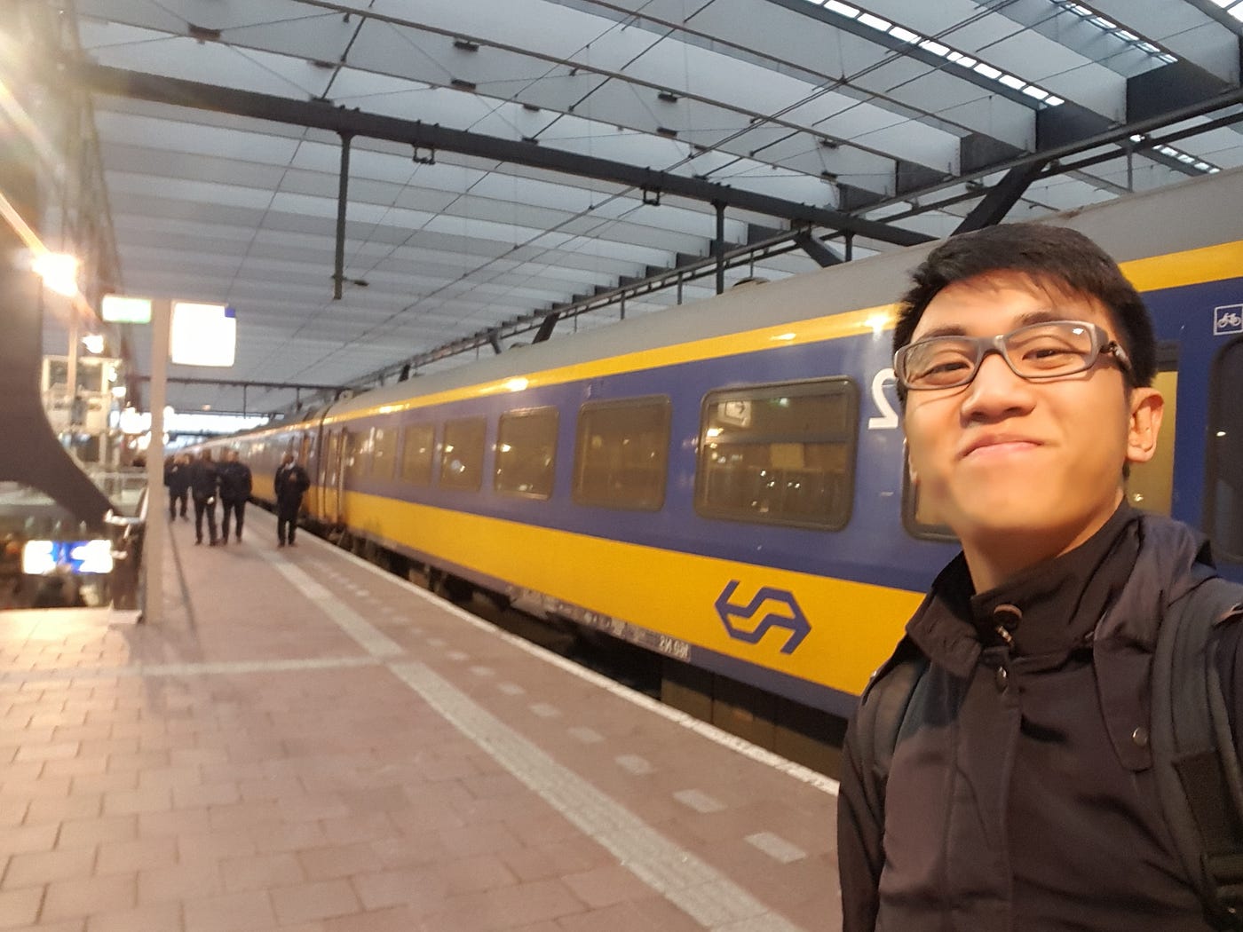 person standing by train
