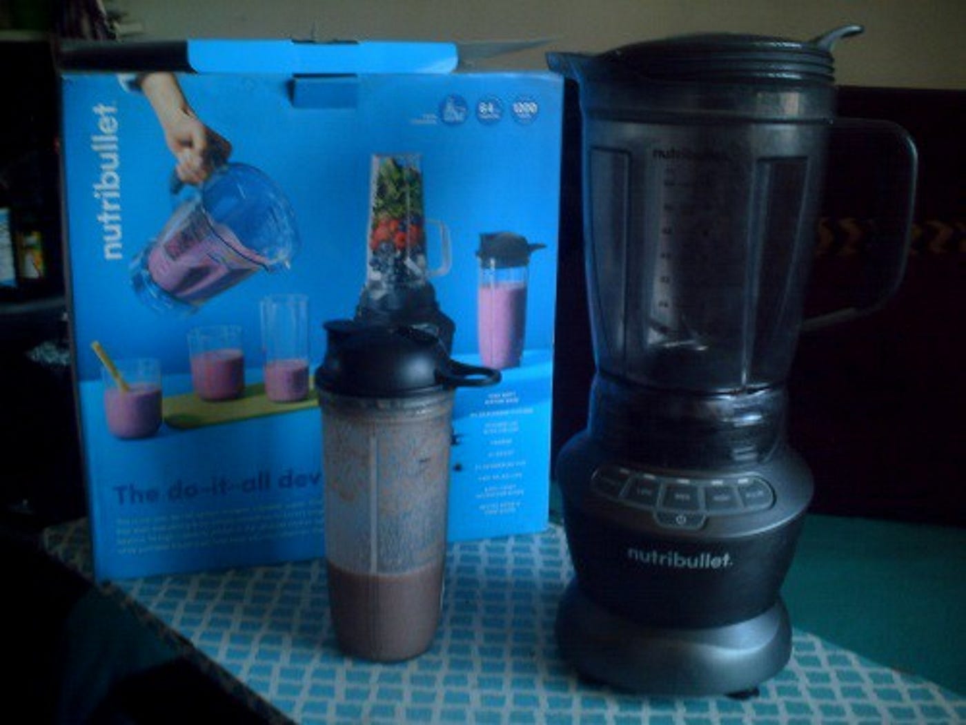 Nutribullet Blender sitting on table with blended drink for eating healthy vegetables Medium story.
