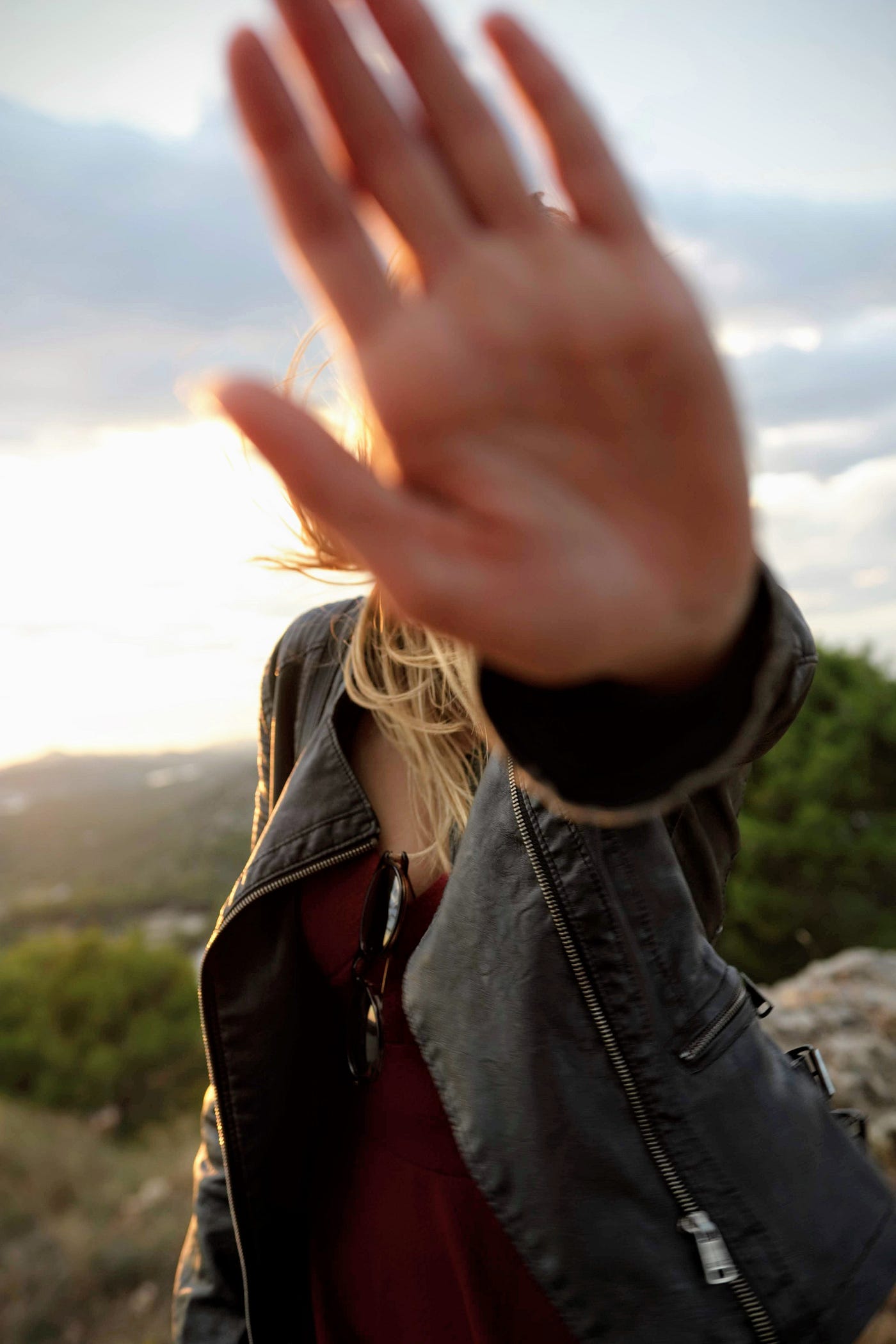 A hand sign to stop — the abuse here