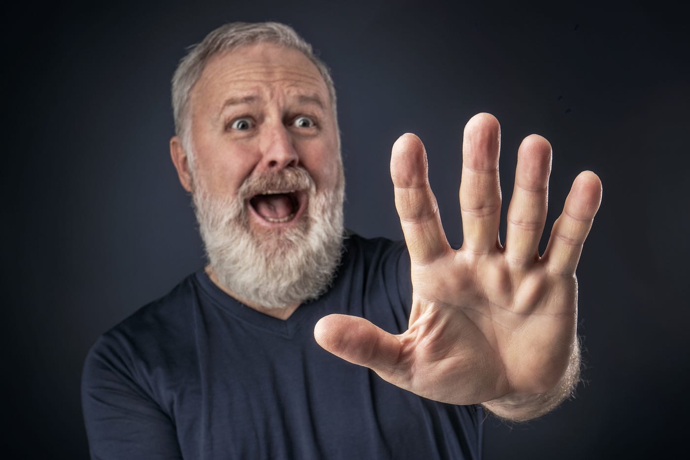 A man screaming in horror and protesting