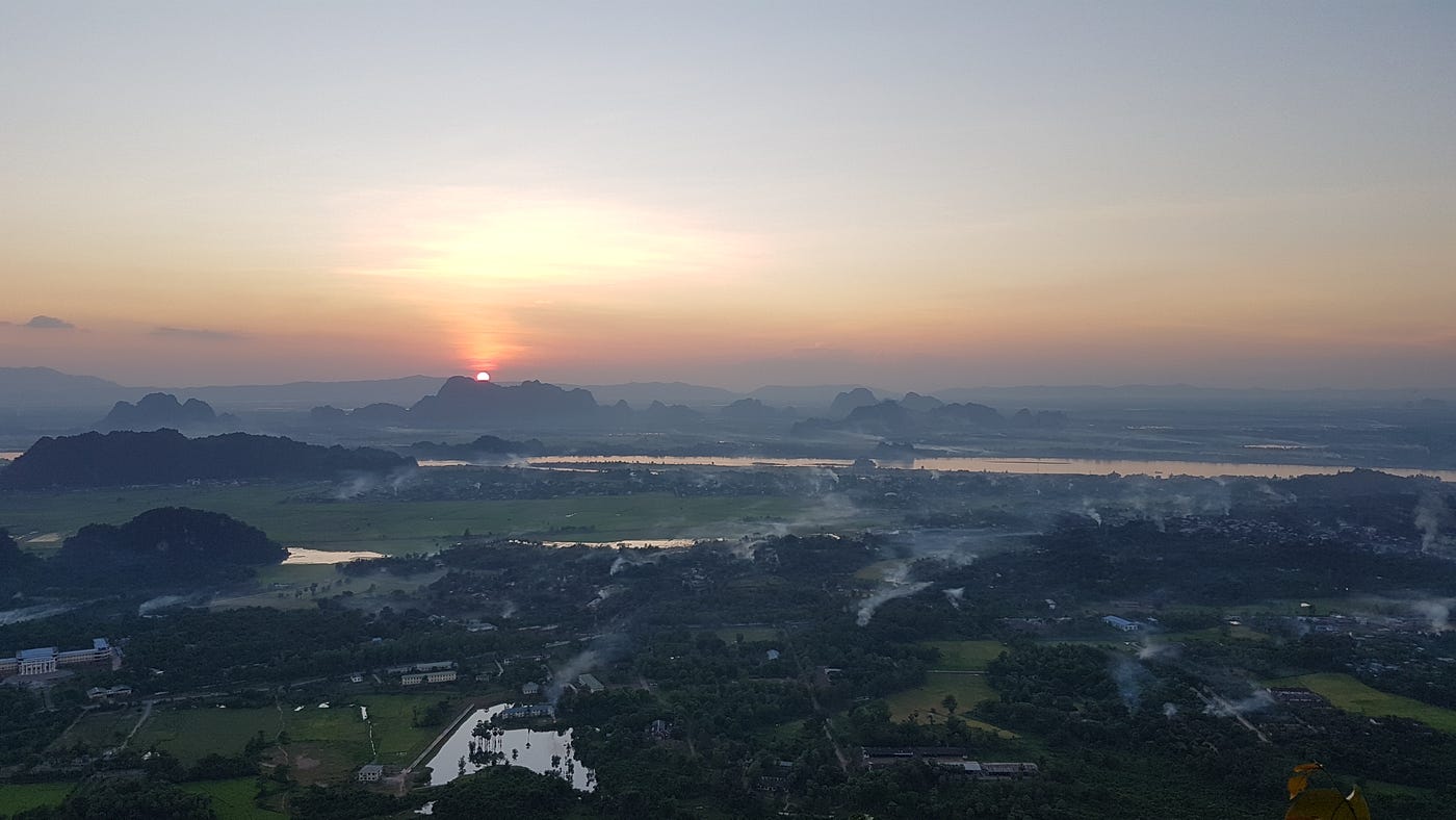 Photo of a sunset off a hill/mountain in Hpa-An