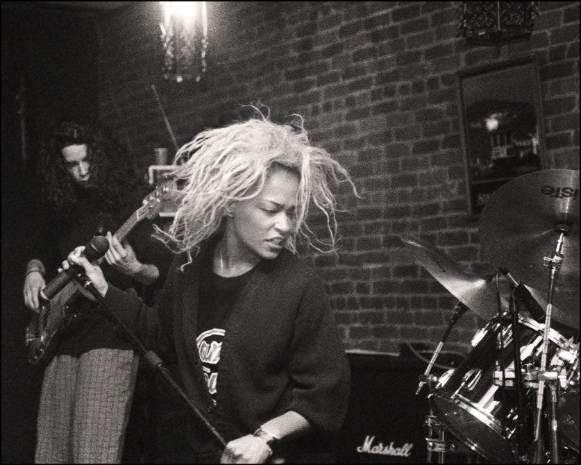 Black and white photo of Tina Bell performing.