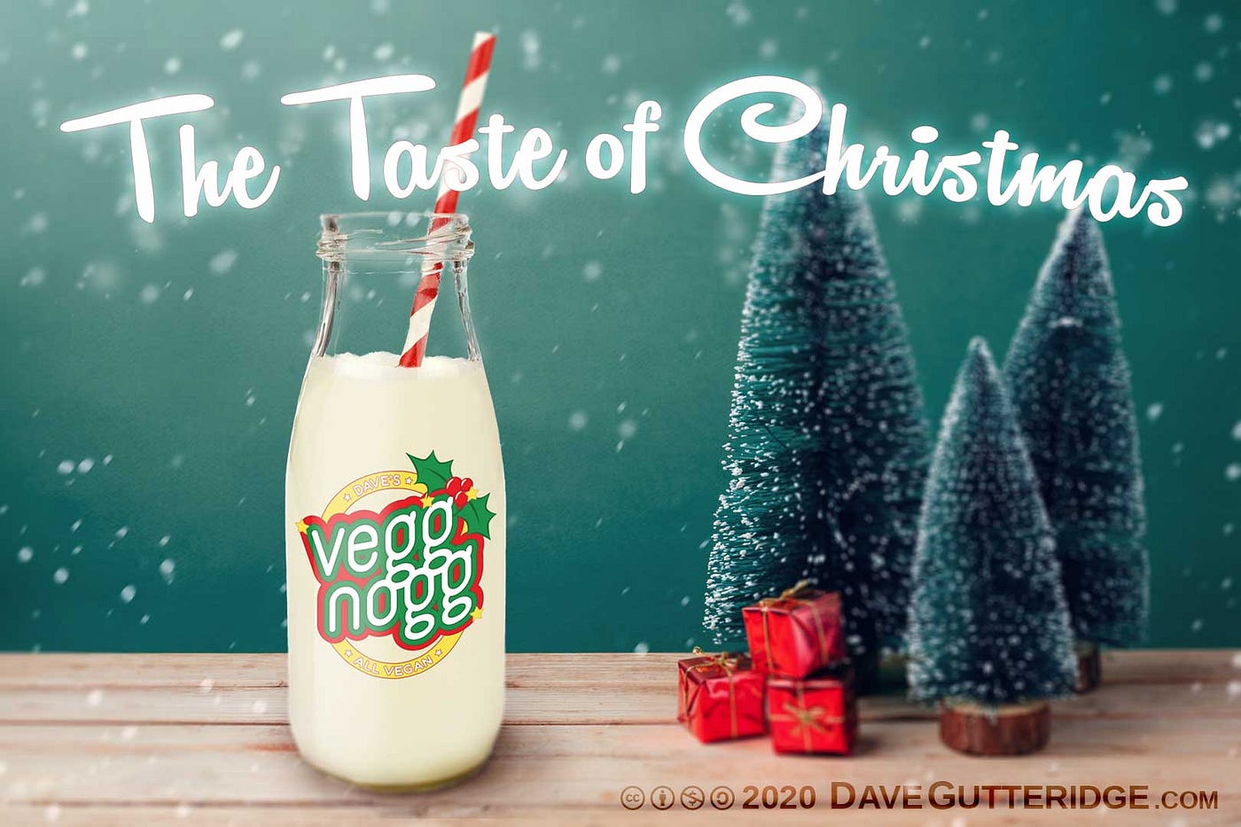 A bottle of Vegg Nogg sitting on a table with a Christmas themed background.
