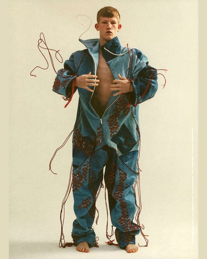 Bethany William’s graduation project exemplifies visible mending with red string on denim