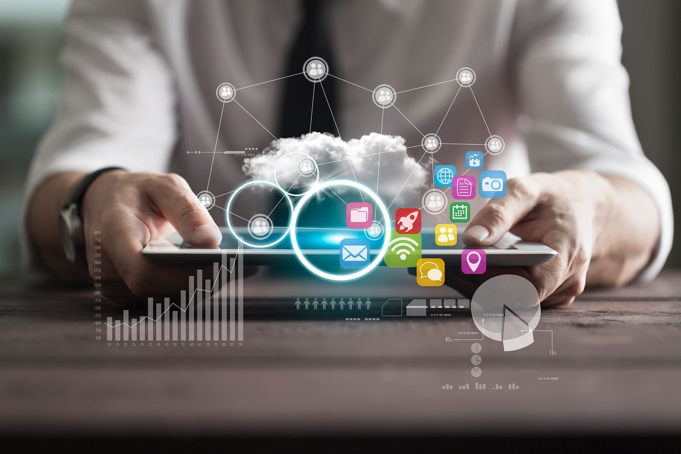 White male professional holding tablet with marketing icons hovering above
