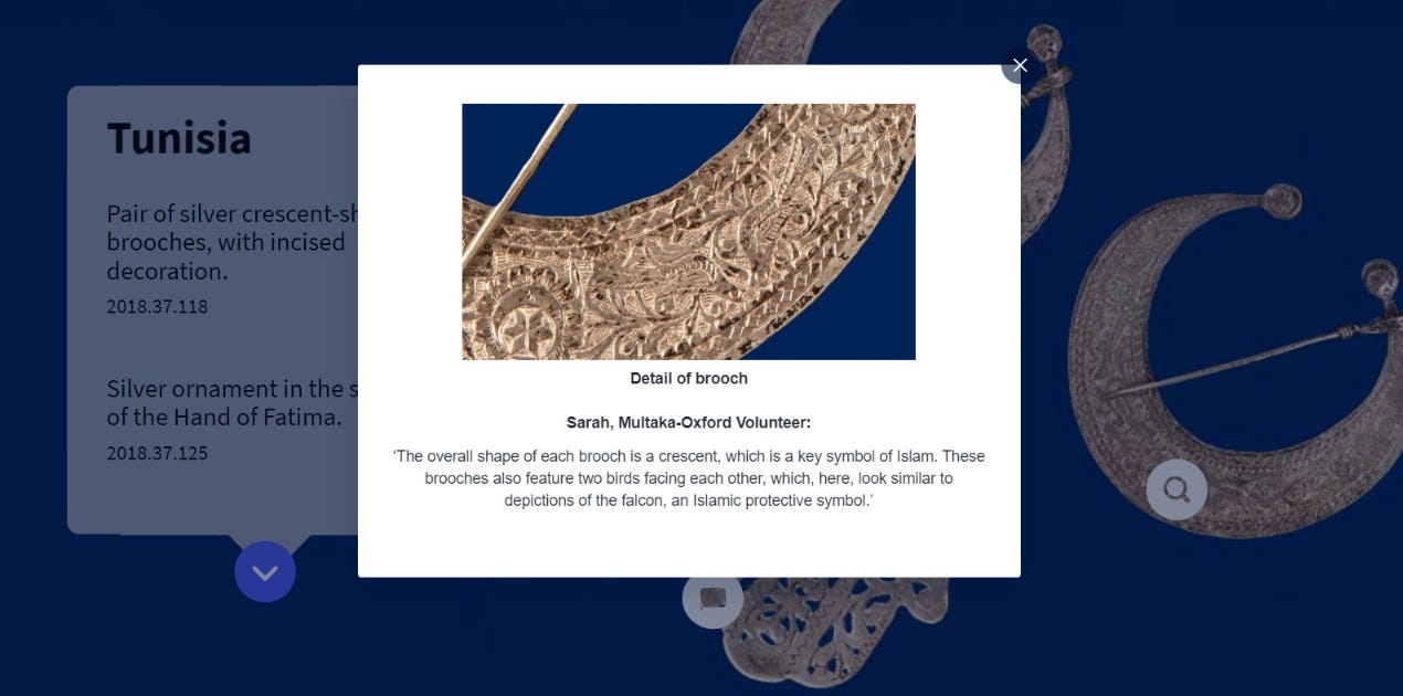 Screenshot of the exhibition showing a close-up of a silver brooch and the label underneath.