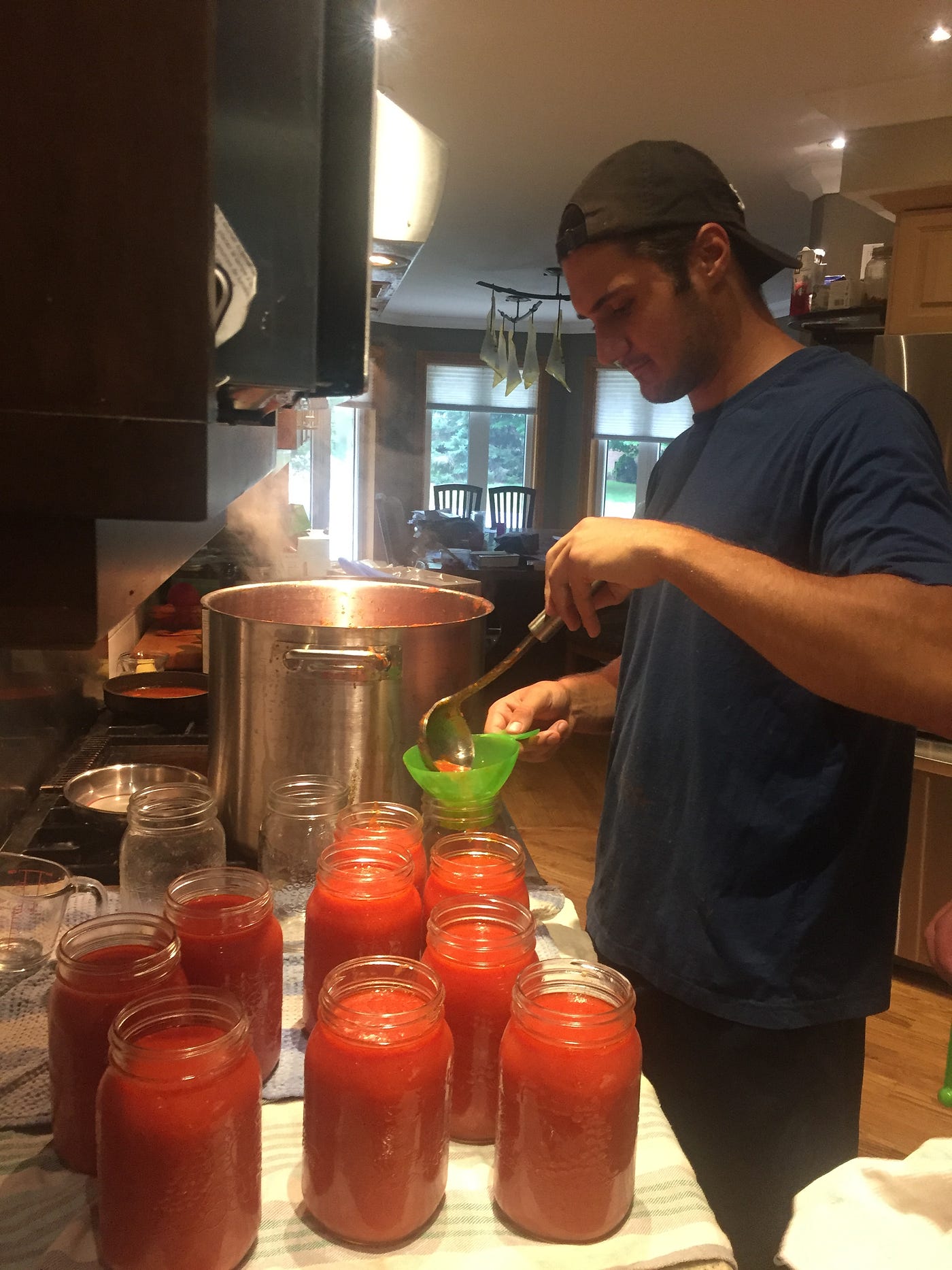 Turning a bushel of tomatoes into beautiful sauce! by Mark