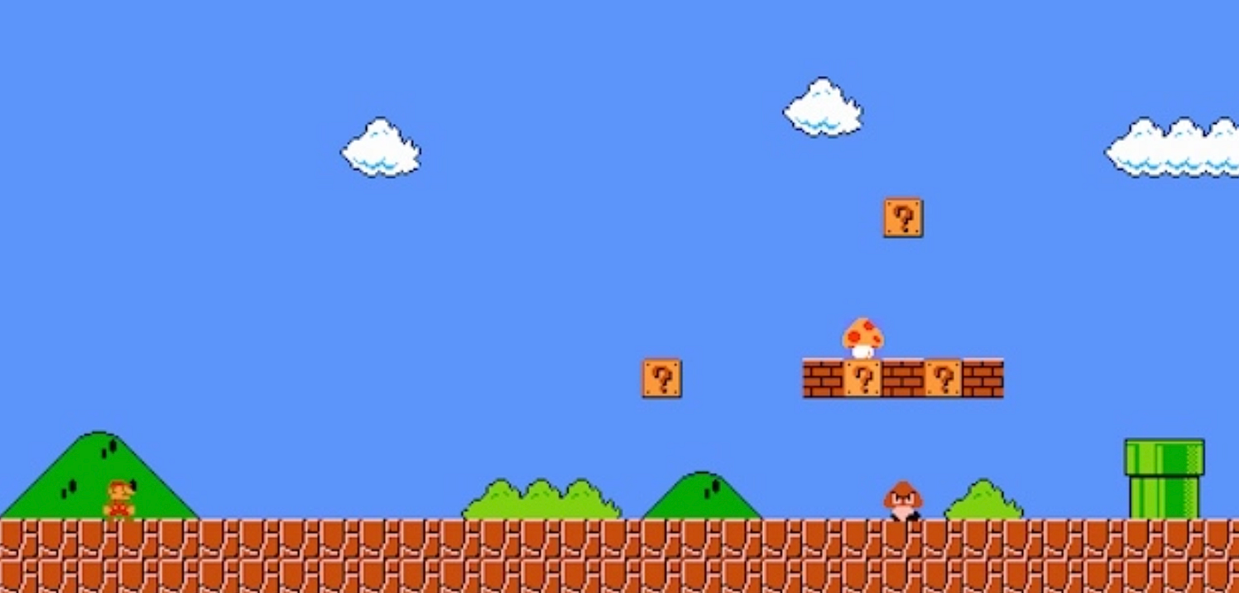 Super Mario Bros start screen. Mario stands on the far left, ahead of him are brick blocks, a green pipe, and enemies.