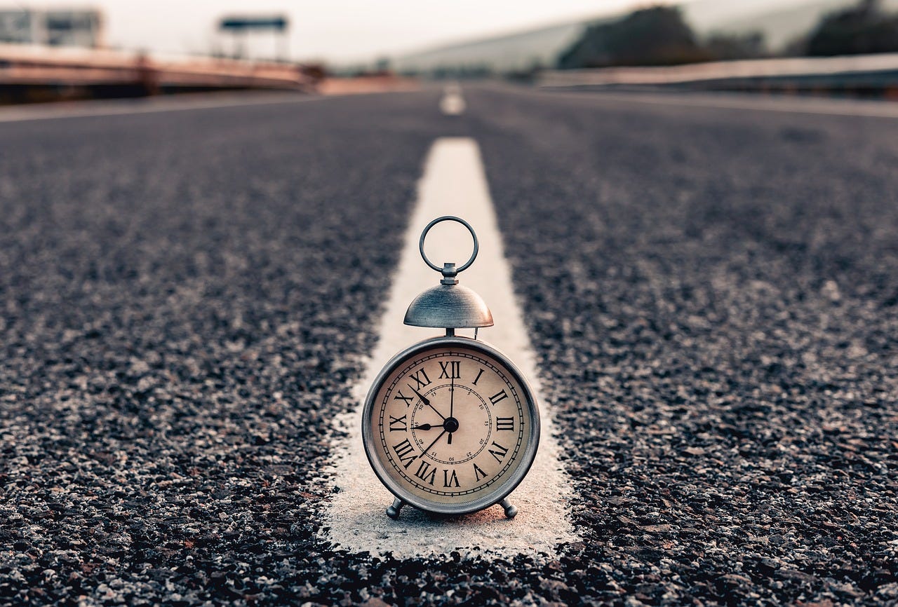 Clock in the middle of the road.