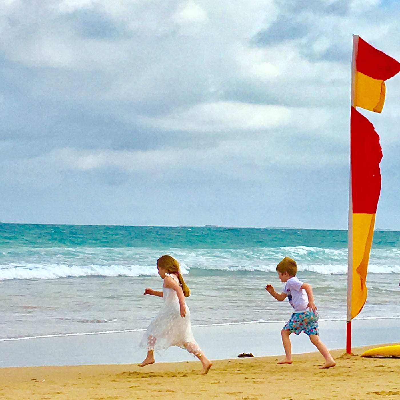 Children playing freely on the beach