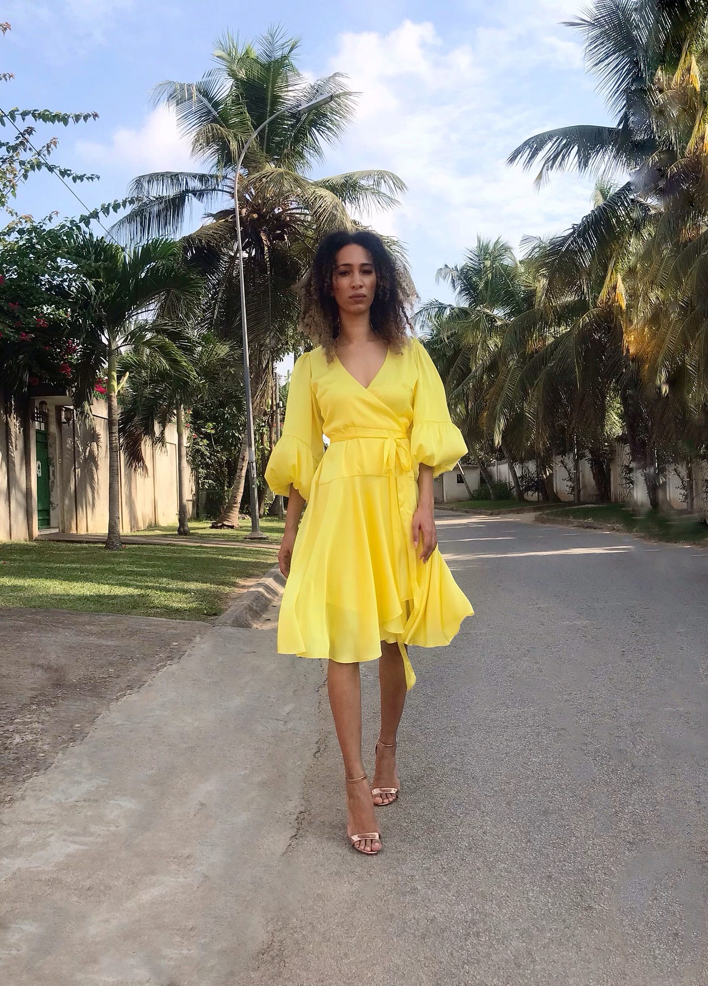 Woman wearing yellow flowing dress