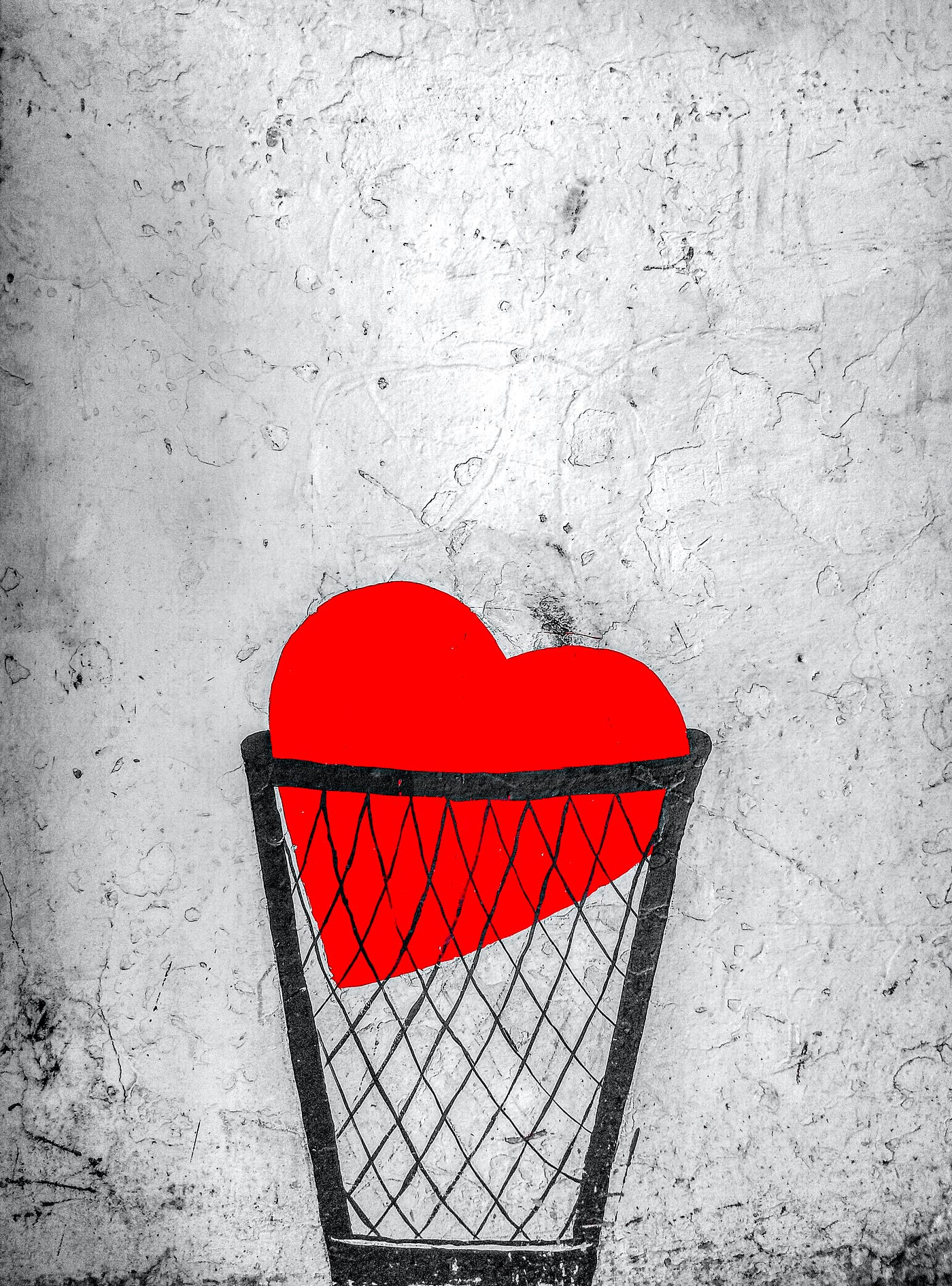 Illustration of a heart in a trash can