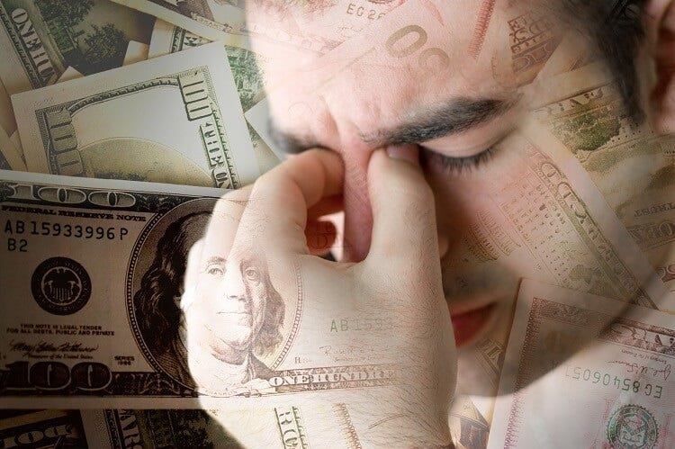 A person feeling the stress of their finances.