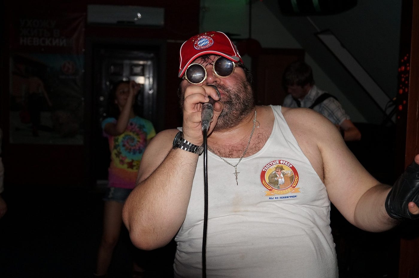 A man in a red hat singing KTV