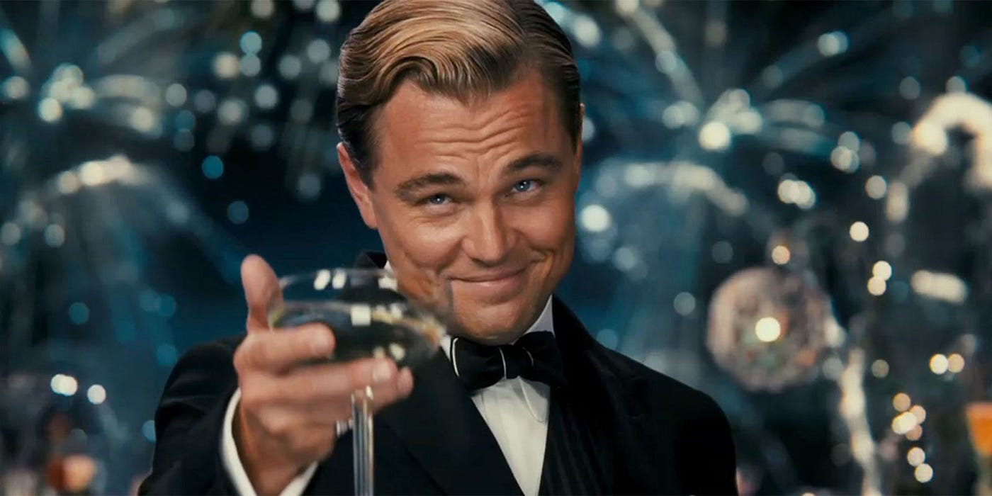 Picture of Leo from Great Gatsby raising a glass