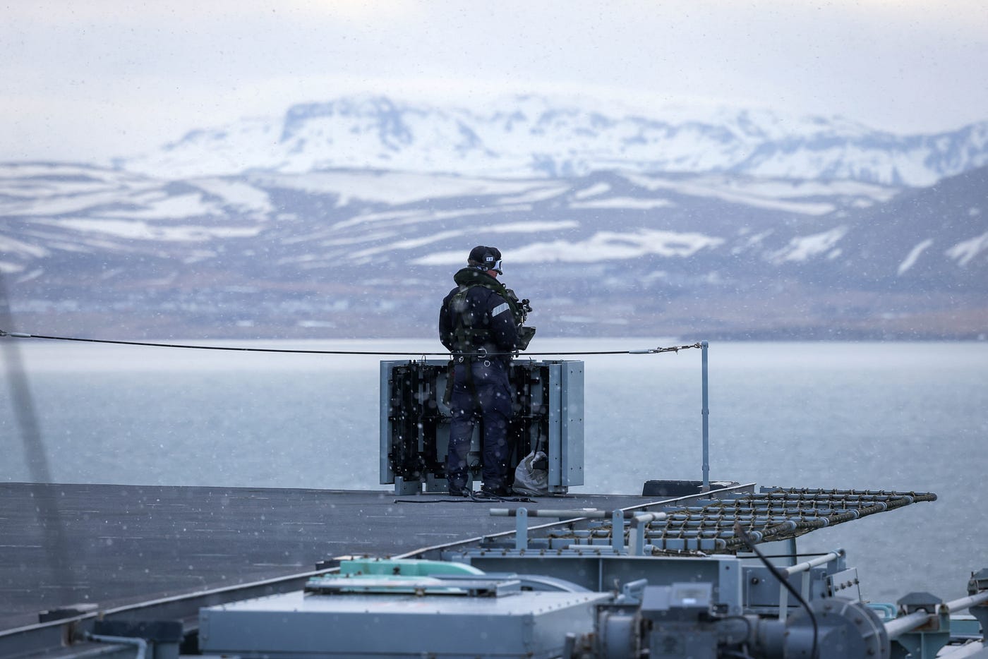 A male sailor over looking Reykjavik from HMS Prince of Wales