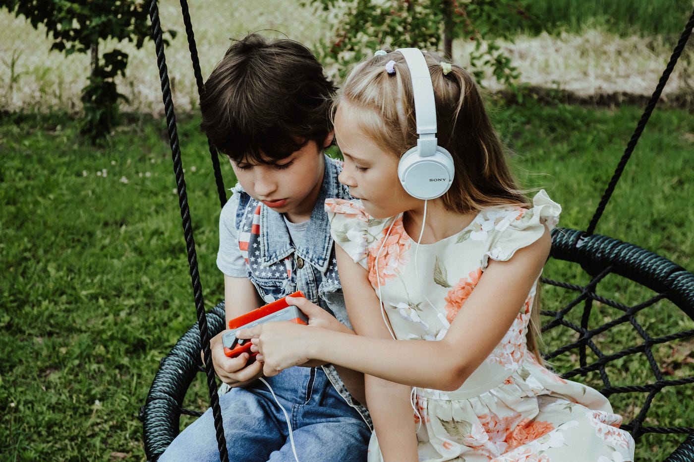 Content children listenng to music onplayground