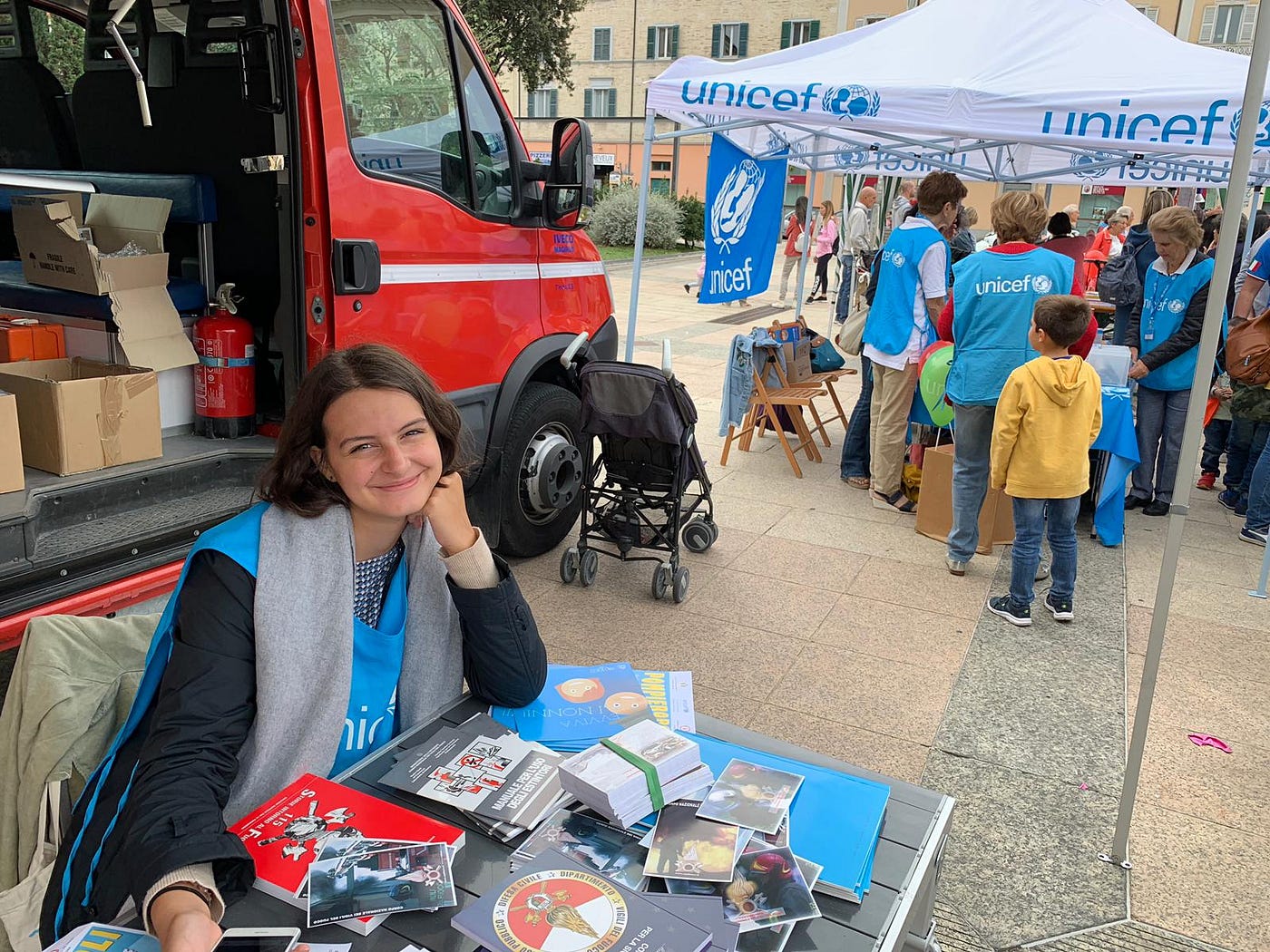 Virginia Maria Barchiesi hosting a fundraising table at a UNICEF event in Ancona, Italy.
