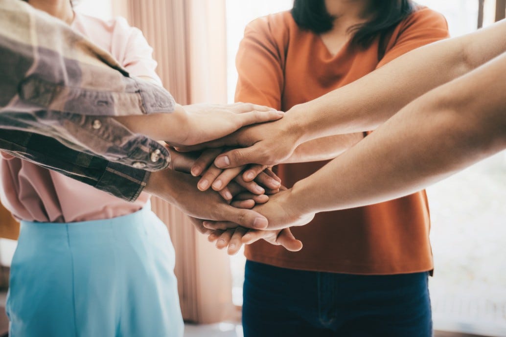 All people interconnected symbolized by hands in a circle