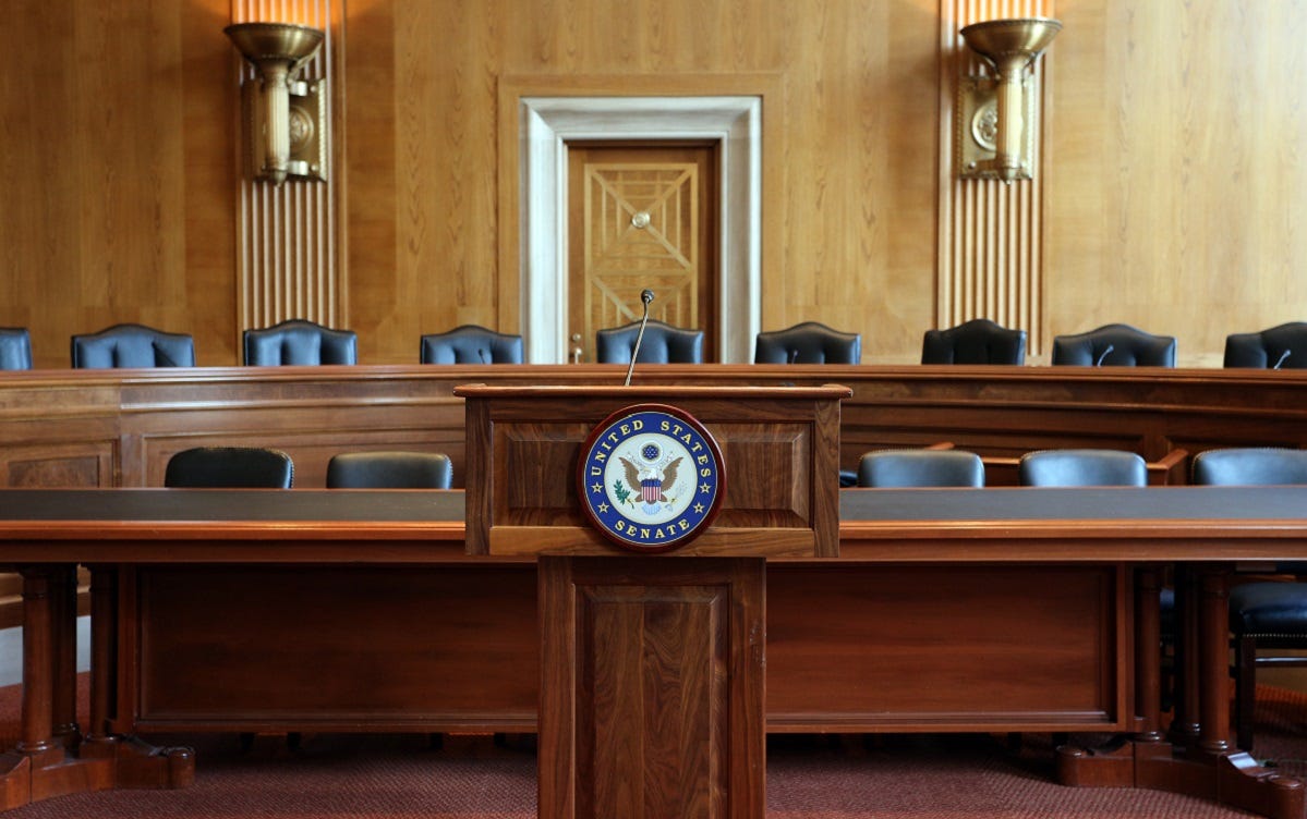 An empty Senate committee room.