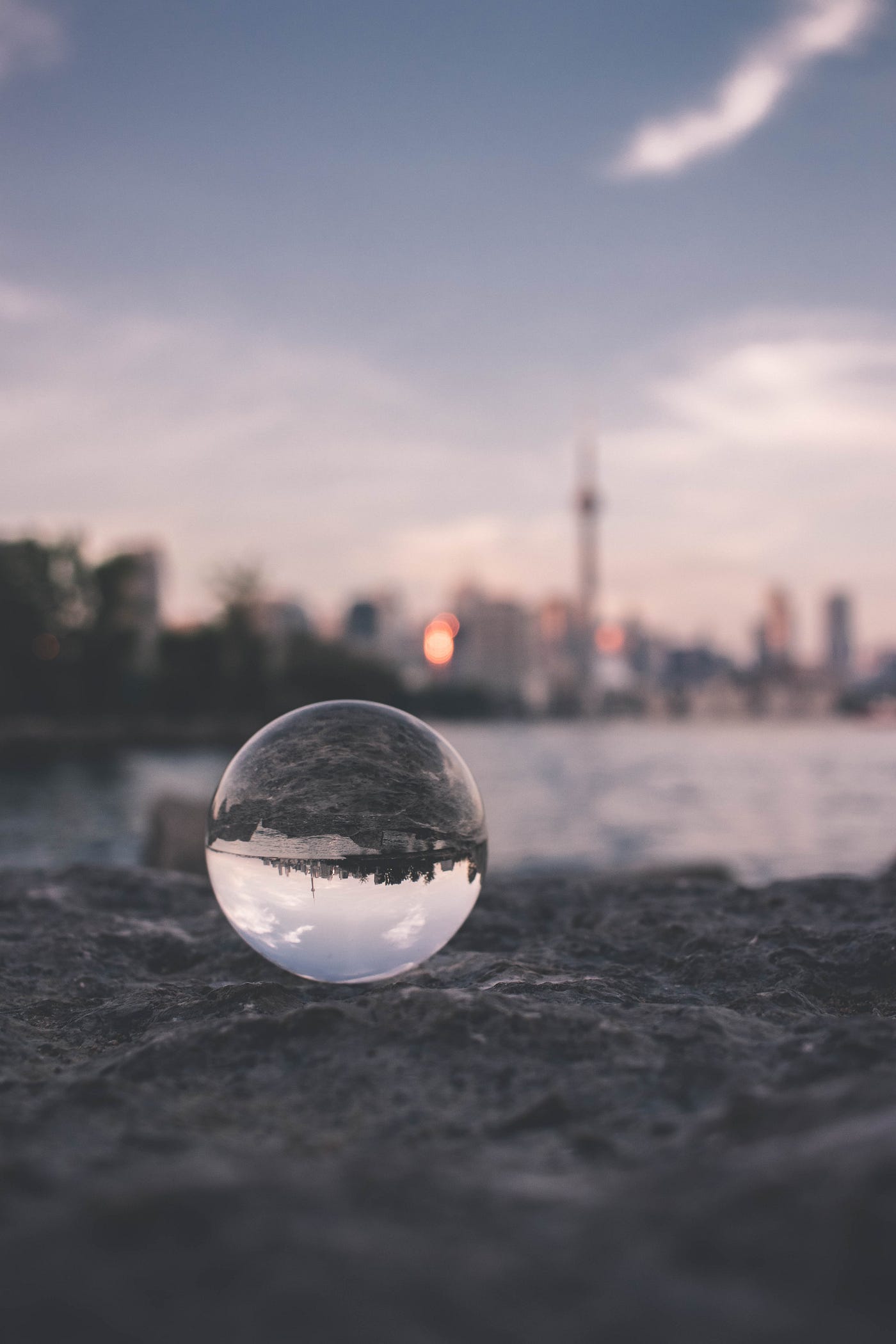 A lens bubble reflecting a city to show an introvert point of view