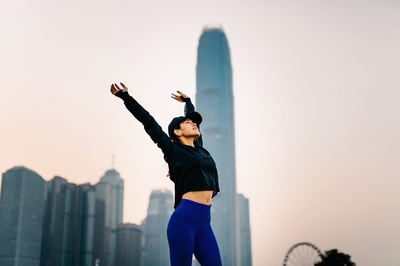 Woman stretching outside.