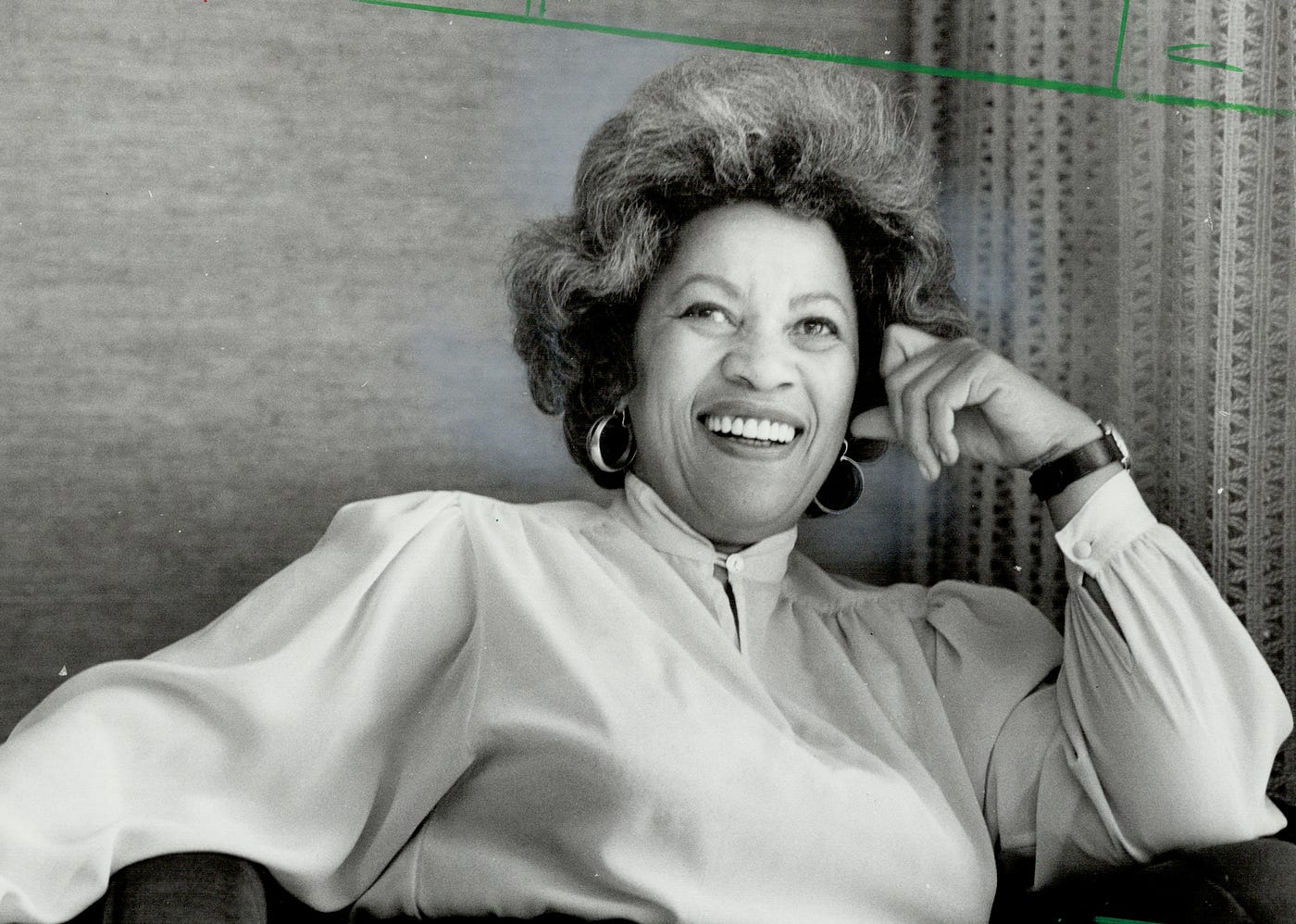 Black and white photo of Toni Morrison smiling.