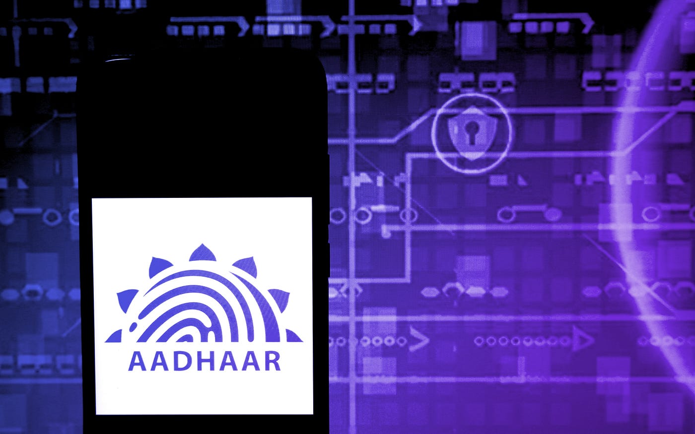 The Aadhaar logo displayed on a smartphone.