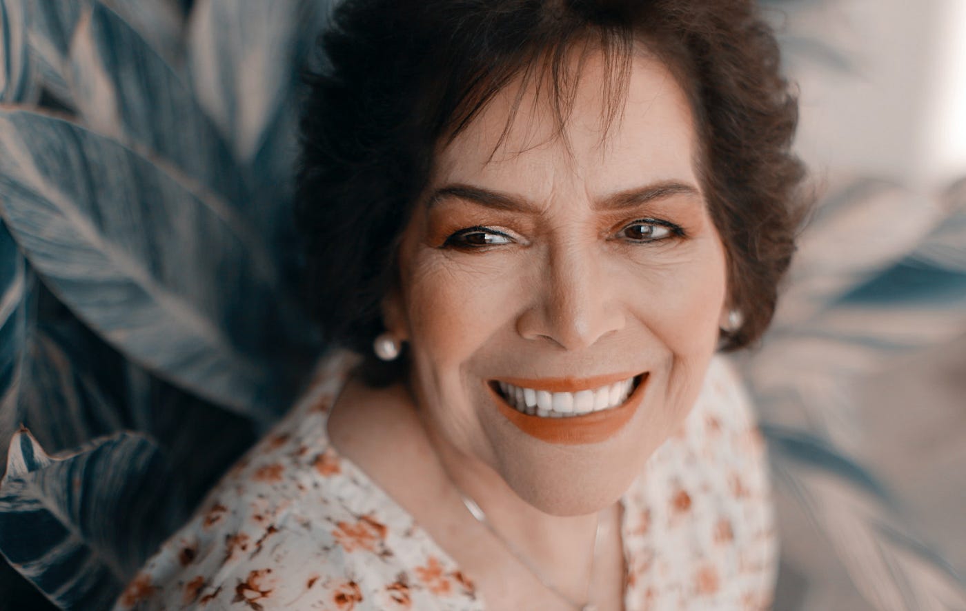 Portrait of a woman smiling toward the left.