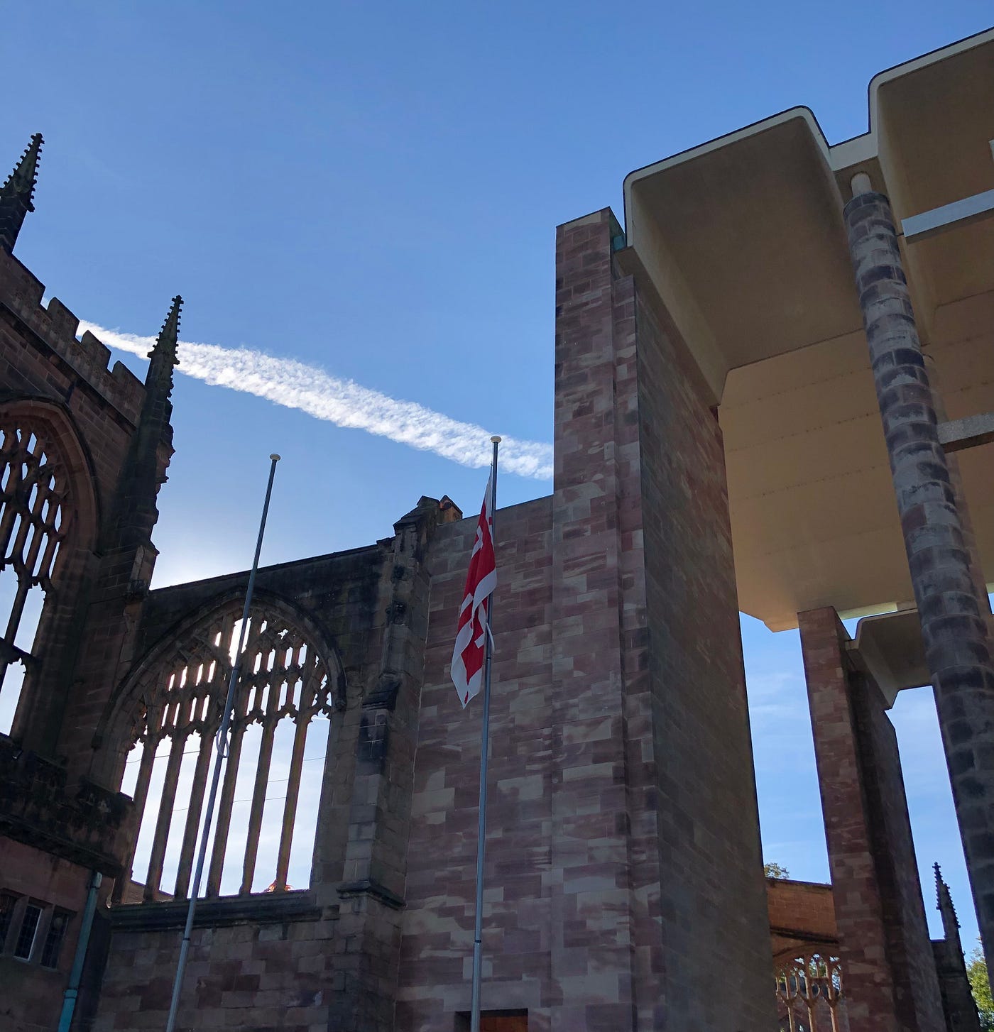 A picture of Coventry Cathedral, where the old medieval part of the building connects with the modern part that was rebuilt after it was bombed in World War II