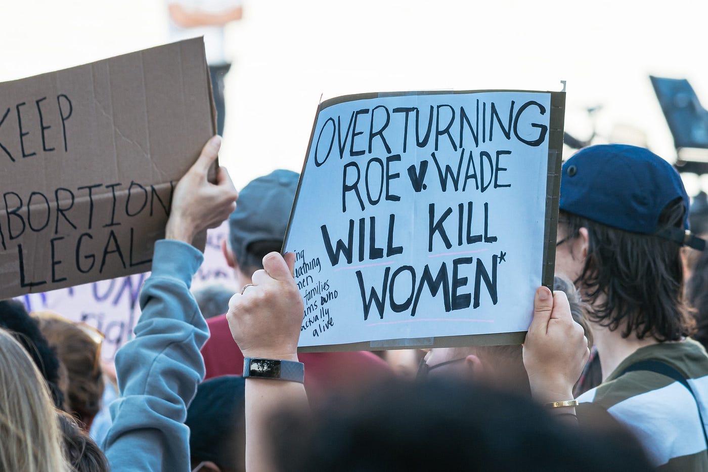 IMAGE: Signs at a demonstration reading “Keep abortion legal” and “Overturning Roe v. Wade will kill women”