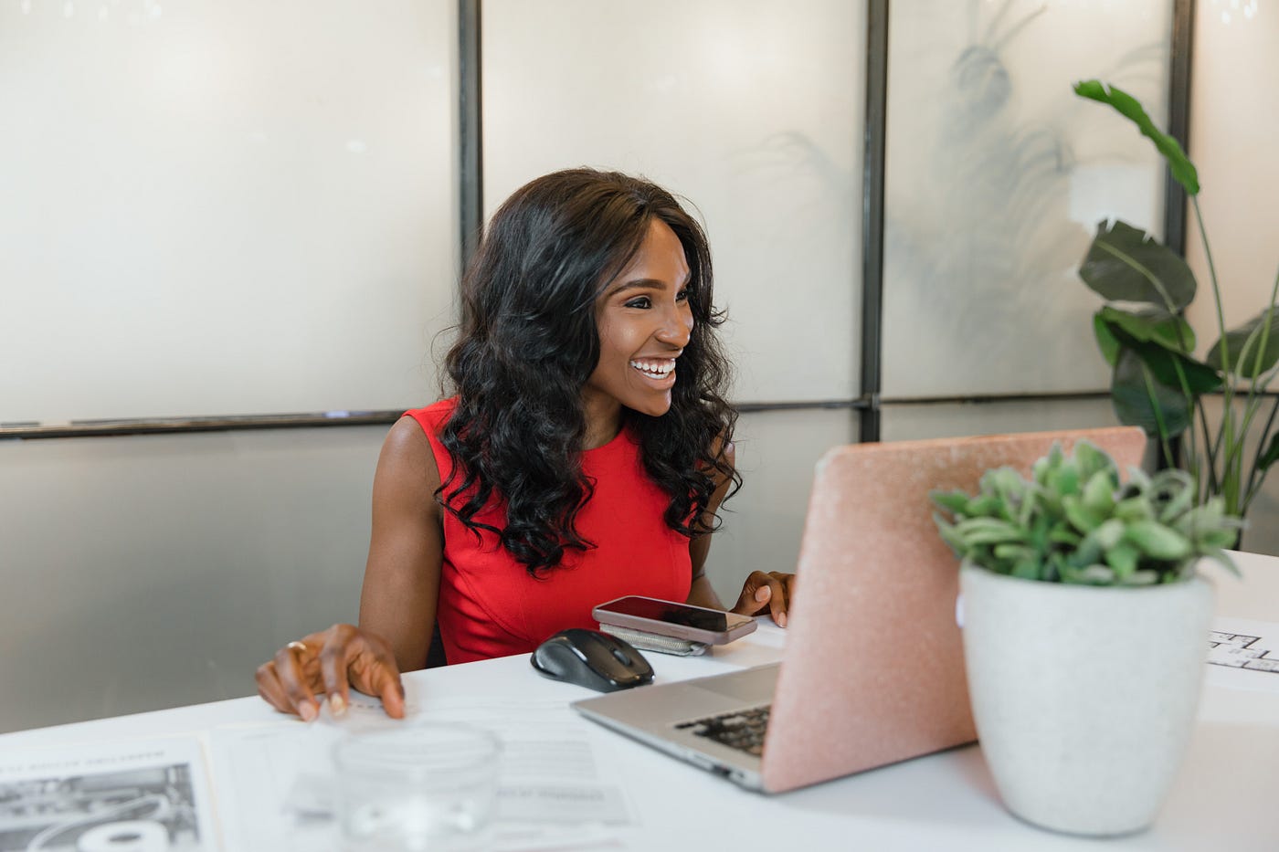 Laughing BAME woman at work office