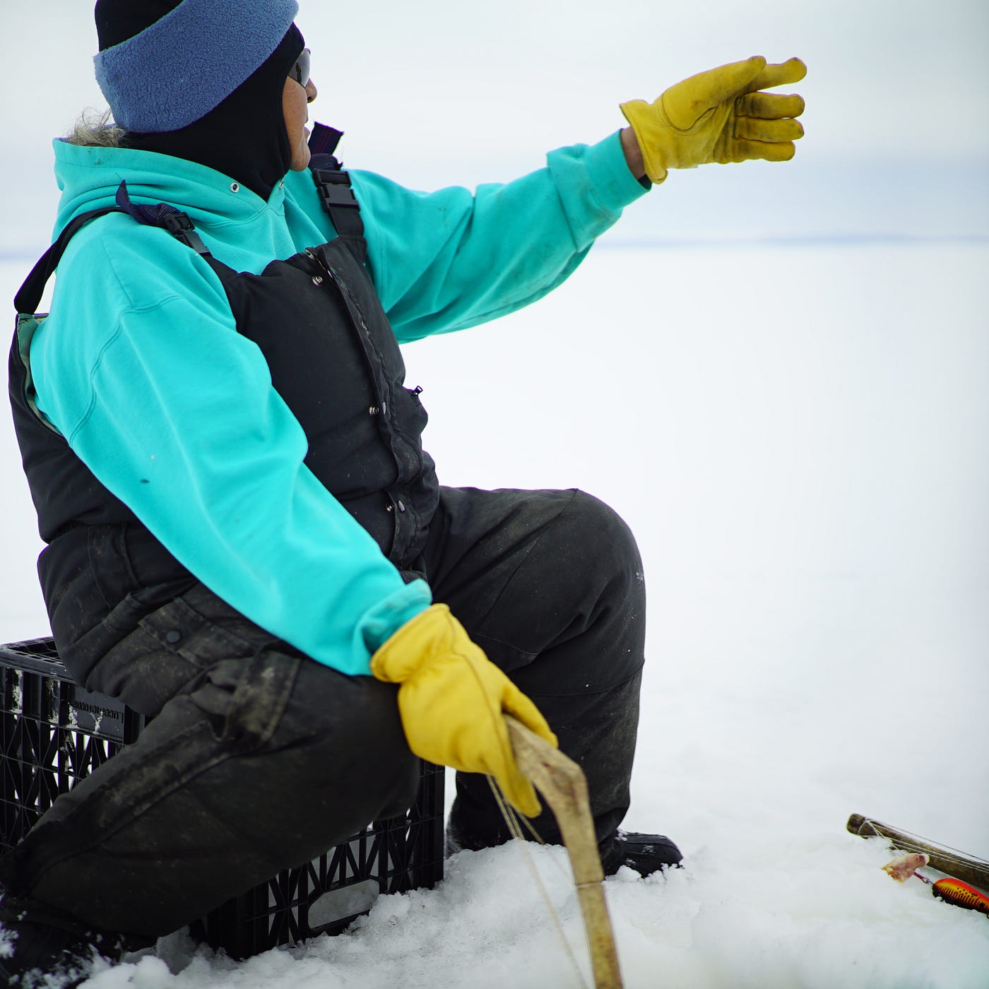a fisherwoman from Selawik ice fishing on Selawik Lake