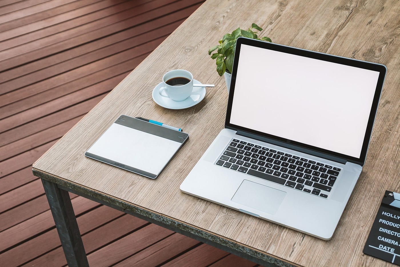 writing desk, ready to write on Medium and Simily — laptop, notepad, and coffee