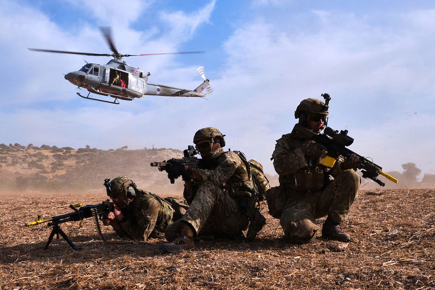 An image of Royal Marines on the ground conducting an exercise.