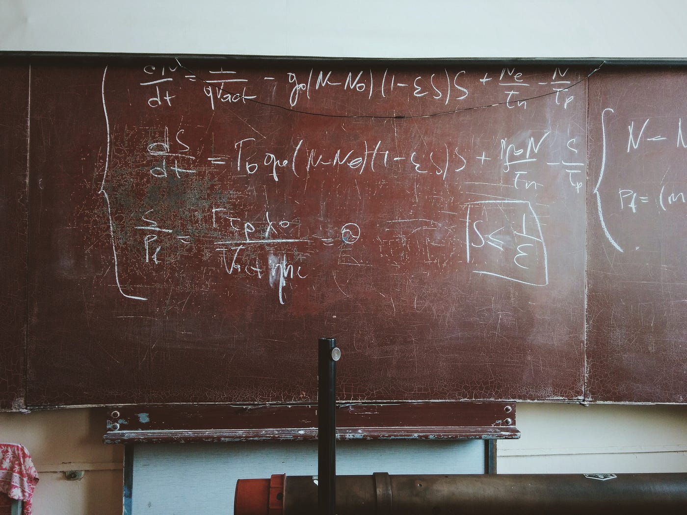 Black board with difficult looking equation