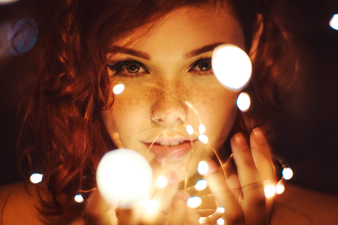 A bewitching young woman with red hair and freckles.
