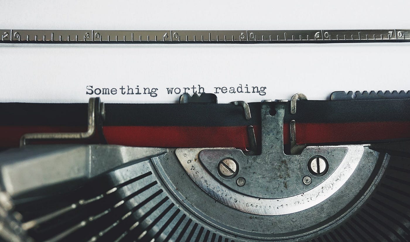 Typewriter typing out the words Something Worth Reading