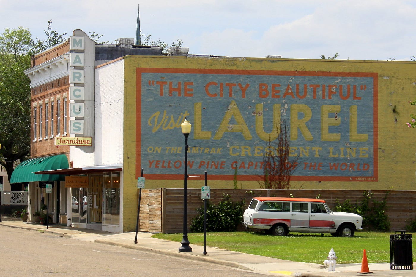 Photo of a welcome mural on a building at the entry to Laurel Mississippi.