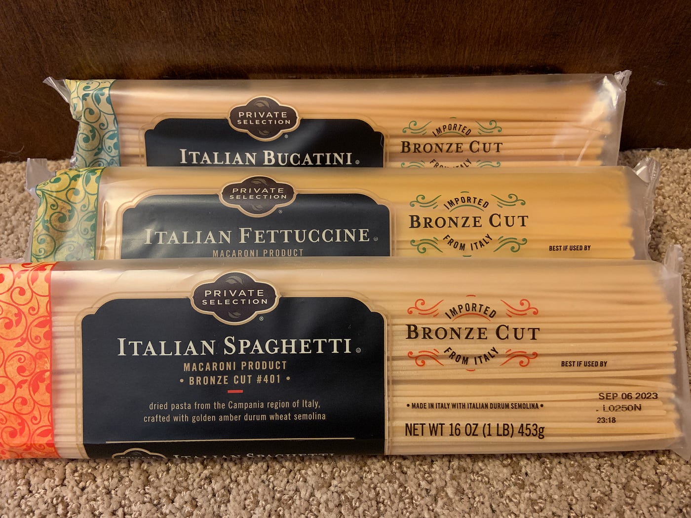 Three kinds of uncooked noodles: spaghetti, fettuccine, and bucatini, all from King Soopers Private Selection.